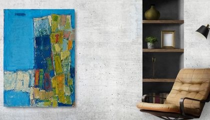 Liverpool Collection print — blue and ochre abstract shown framed beside an armchair